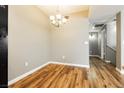 Simple dining room with wood floors and a chandelier at 2011 Sue Ct # 201, Las Vegas, NV 89108