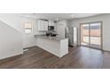 Modern kitchen with stainless steel appliances and island at 6288 Blood Lily St, Las Vegas, NV 89122