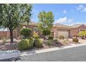 One-story house with stone accents and landscaped yard at 7145 Cypress Run Dr, Las Vegas, NV 89131