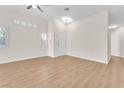 Living room with wood-look floors and neutral walls at 7827 Lobella St, Las Vegas, NV 89123