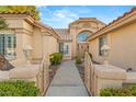 Inviting walkway to the front door with decorative gates at 1913 Madagascar Ln, Las Vegas, NV 89117