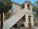 Two-story building with stairs and AC units at 1881 W Alexander Rd # 2095, North Las Vegas, NV 89032