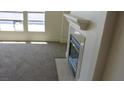 Gas fireplace with tile surround in living room at 10717 Refectory Ave, Las Vegas, NV 89135