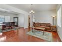 Living room with hardwood floors and a fireplace at 4977 Crimson Mare Rd, Las Vegas, NV 89139