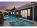 Luxury pool and spa with a covered patio at 10056 Amethyst Hills Ave, Las Vegas, NV 89148