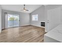 Bright and airy living room with wood-look flooring and a fireplace at 2725 S Nellis Blvd # 2148, Las Vegas, NV 89121