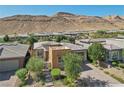 Aerial view of house and surrounding community at 10057 Regency Canyon Way, Las Vegas, NV 89148