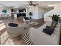 Virtually staged living room with hardwood floors at 10843 Leatherstocking Ave, Las Vegas, NV 89166