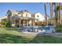 Inviting kidney-shaped pool and spa, backyard oasis at 1002 Prestige Meadows Pl, Henderson, NV 89052