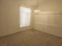 Spacious dining area with a chandelier and ample natural light at 841 Lusterview Ct, Las Vegas, NV 89123