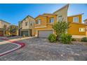 Two story house with attached garage and brick driveway at 7057 Millers Run St, North Las Vegas, NV 89084