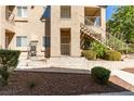 Exterior view of building showing stairs and landscaping at 2110 Los Feliz St # 1046, Las Vegas, NV 89156