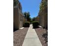 Community walkway between buildings at 1909 Villa Palms Ct # 109, Las Vegas, NV 89128