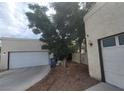 Two-car garage with automatic doors and ample parking space at 3805 Twig Ln, Las Vegas, NV 89108