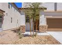 Front entry with stone accents and drought-tolerant landscaping at 113 Parliament Cyn, Mesquite, NV 89027