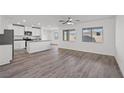 Open concept kitchen with island and gray flooring at 1700 Sandia Rock Ave, North Las Vegas, NV 89032