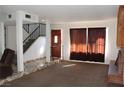 Living room with carpet, fireplace, and staircase at 3056 Plaza St, Las Vegas, NV 89121