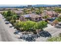 Two-story house with solar panels, three-car garage, and landscaped yard at 6102 Rio Nevada Way, Las Vegas, NV 89113