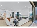 Open floor plan living room with sectional sofa and large window at 601 Overlook Rim Dr, Henderson, NV 89012