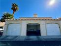 Three-car garage with two garage doors and one open door at 1900 N Torrey Pines Dr # 223, Las Vegas, NV 89108