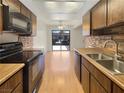 Well-equipped kitchen featuring modern appliances and wood cabinetry at 1868 Avacado Ct, Henderson, NV 89014