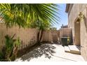 Private patio with mature plants and AC unit at 7732 Almeria Ave, Las Vegas, NV 89128