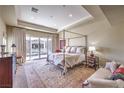 Main bedroom with access to a balcony and a cozy sitting area at 9205 Tesoras Dr # 401, Las Vegas, NV 89144