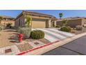 Single-story house with attached garage and landscaping at 177 Spyglass Way, Mesquite, NV 89027