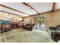 Spacious living room featuring a fireplace and sliding glass doors at 4415 Flowerdale Ct, Las Vegas, NV 89103