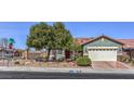 Beautiful single-story home with landscaped front yard and two-car garage at 220 Du Fort Ave, Henderson, NV 89002