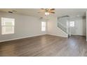 Spacious living room with wood-look flooring and neutral color palette at 747 Shadwell St, Las Vegas, NV 89178