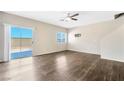 Living room with wood-look floors and sliding door at 8850 Duncan Barrel Ave # 103, Las Vegas, NV 89178