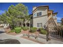 Two-story building with stairs and landscaping at 8501 W University Ave # 1119, Las Vegas, NV 89147