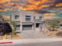 Modern home with gray exterior, attached garage, and paved driveway at 510 Duvet Ct, Henderson, NV 89012