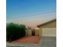 House exterior showcasing a side yard with a gate and gravel at 3614 Calmosa St, Las Vegas, NV 89103