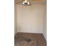 Empty bedroom with carpeted floor and ceiling fan at 1300 S Arlington St # 120, Las Vegas, NV 89104