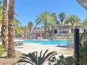 Inviting community pool with palm trees and lounge chairs at 9050 W Warm Springs Rd # 1016, Las Vegas, NV 89148