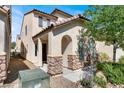 Two-story house with stone accents and landscaping at 4972 Groveland Ave, Las Vegas, NV 89139