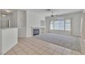 Living room with fireplace and tile floors at 107 Topsail Dr, Boulder City, NV 89005