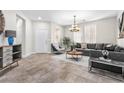 Spacious living room with gray sectional sofa and stylish decor at 171 Fulgora St, Henderson, NV 89074