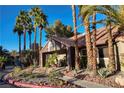 Community building with Spanish tile roof and landscaping at 5020 S Rainbow Blvd # 103, Las Vegas, NV 89118