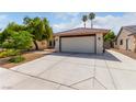 Single-story house with attached garage and gravel landscaping at 4323 Veranda Hill Ct, North Las Vegas, NV 89031