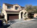 Two-story house with brown garage door and landscaping at 8178 Rock Meadows Dr, Las Vegas, NV 89178