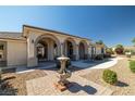 Elegant front porch with arched entryways and a fountain at 1981 Labrador St, Pahrump, NV 89048