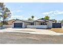 Single story home with modern updates, two car garage, and landscaped yard at 3737 N Braewood Ave, Las Vegas, NV 89120