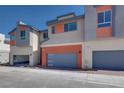 Modern two-story home with gray and orange exterior at 2552 Catallo Ave, Henderson, NV 89044