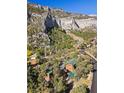 Aerial view of a charming log cabin nestled in a mountain setting with stunning views at 324 Crestview Dr, Mount Charleston, NV 89124