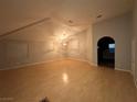 Spacious living room with vaulted ceilings and light wood flooring at 2622 Rimpacific Cir, Las Vegas, NV 89146