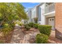 Neat brick walkway leads to the charming white building at 656 Tam O Shanter, Las Vegas, NV 89109