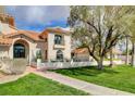 Front view of a beautiful two-story house with a walkway leading to the entrance at 3734 Mahalo Cir, Logandale, NV 89021